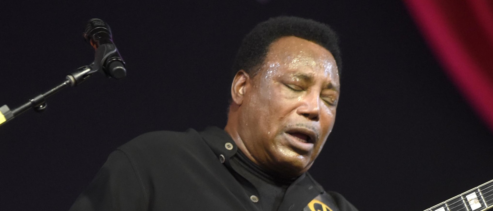 George Benson performing live at a concert in 2025
